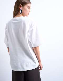 Model wearing Graphic martini print oversized tee in ivory