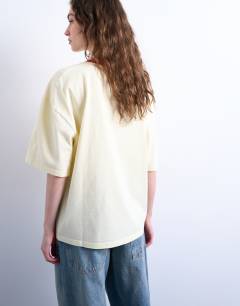 Model wearing Graphic Napoli contrast ringer oversized tee in ecru