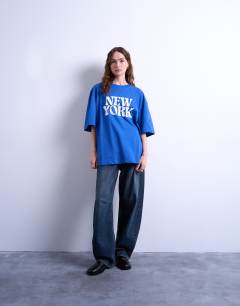 Model wearing Graphic New York oversized tee in cobalt blue