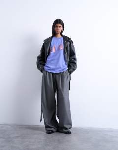 Model wearing Graphic New York oversized tee in purple