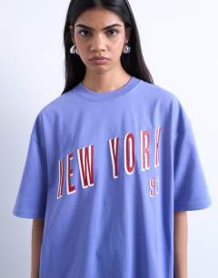 Model wearing Graphic New York oversized tee in purple
