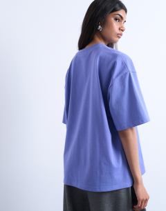 Model wearing Graphic New York oversized tee in purple