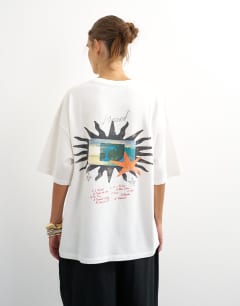 Model wearing Graphic 'Nomad' oversized t-shirt in white