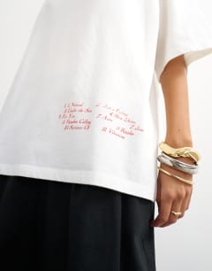Model wearing Graphic 'Nomad' oversized t-shirt in white