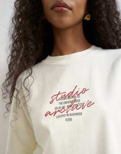Model wearing Graphic oversized t shirt in ecru
