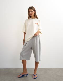 Model wearing Graphic 'Palm Grove' oversized t-shirt in ecru