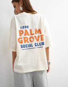 Model wearing Graphic 'Palm Grove' oversized t-shirt in ecru