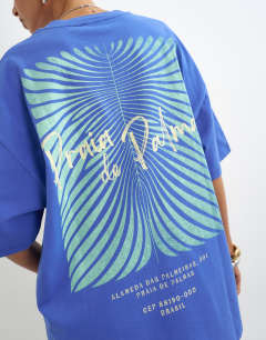 Model wearing Graphic 'Palm' oversized t-shirt in blue