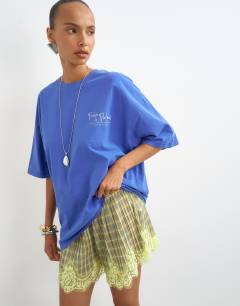 Model wearing Graphic 'Palm' oversized t-shirt in blue