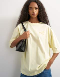 Model wearing Graphic 'Rodeo Rain' oversized t-shirt in buttermilk