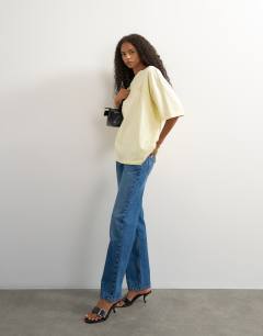 Model wearing Graphic 'Rodeo Rain' oversized t-shirt in buttermilk