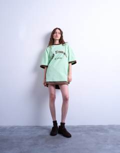 Model wearing Graphic San Francisco oversized tee in green