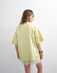 Model wearing Graphic Santiago oversized tee in green