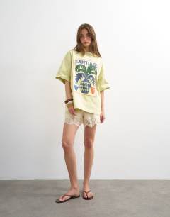 Model wearing Graphic Santiago oversized tee in green