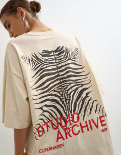 Model wearing Graphic 'Studio Archive' oversized t-shirt in ecru