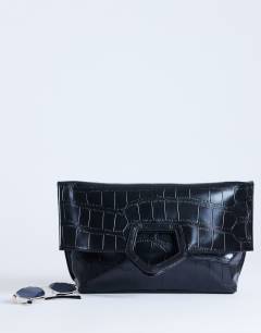 Model wearing Gregry folded clutch bag in black croc