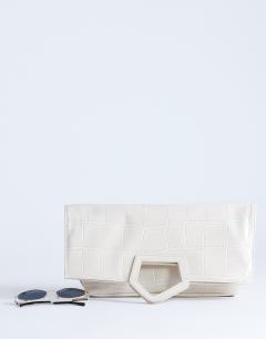 Model wearing Gregry folded clutch bag in off white croc