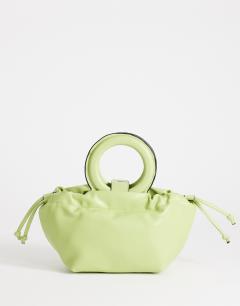 Model wearing Grette grab bag in lime