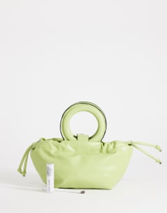 Model wearing Grette grab bag in lime