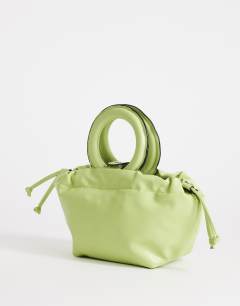 Model wearing Grette grab bag in lime