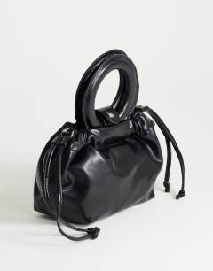 Model wearing Grette small grab bag in black