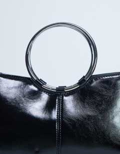 Model wearing Griffith metal ring handle grab bag in black