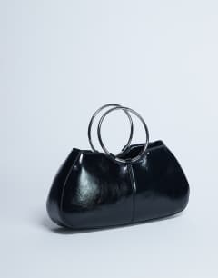 Model wearing Griffith metal ring handle grab bag in black