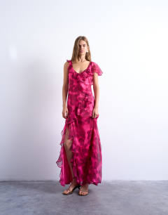 Model wearing Grown on ruffle sleeve occasion maxi dress in blurred pink floral