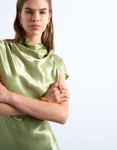Model wearing Grown on sleeve satin dress in olive