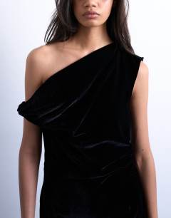 Model wearing Grown on twist shoulder velvet mini dress in black