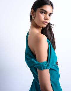 Model wearing Grown on twist shoulder velvet mini dress in teal