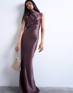 Model wearing Gwyn embellished knot grab bag in gold