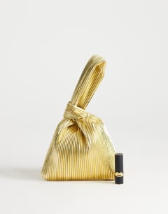 Model wearing Gwyn ribbed grab bag in gold