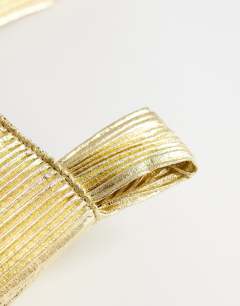 Model wearing Gwyn ribbed grab bag in gold