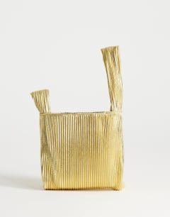 Model wearing Gwyn ribbed grab bag in gold