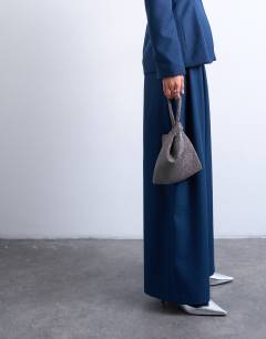 Model wearing Gywn embellished knot grab bag in pewter