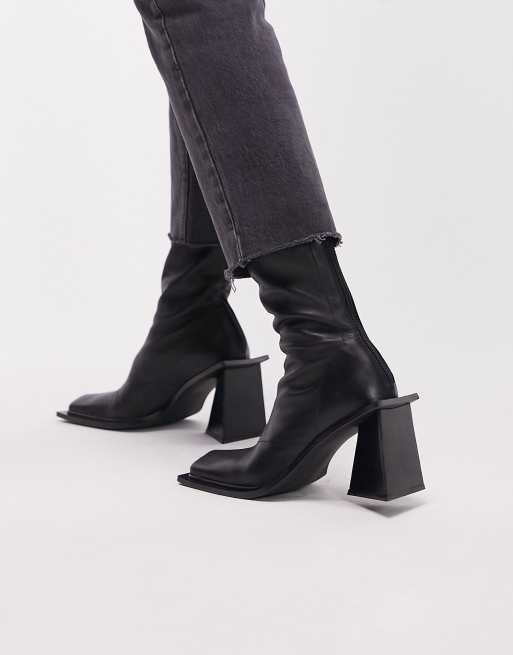 Topshop black leather ankle boots with a sculptural mid-height block heel and sleek square toe. Zip-side fastening. 