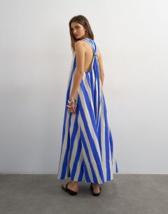 Model wearing Halter deep hem maxi trapeze dress in blue stripe