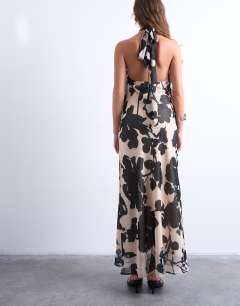 Model wearing Halter layer chiffon dress in black and white floral