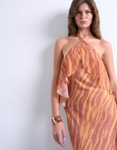 Model wearing Halter layer chiffon dress in pink and cream print