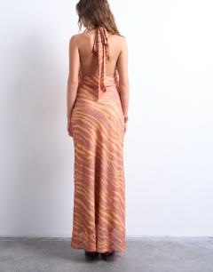 Model wearing Halter layer chiffon dress in pink and cream print