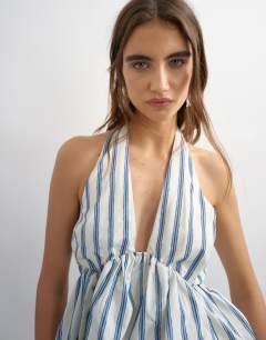 Model wearing Halter neck bubble hem top in cream stripe