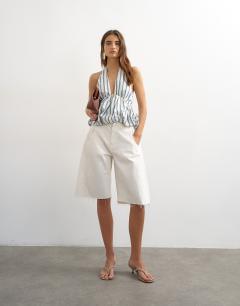 Model wearing Halter neck bubble hem top in cream stripe
