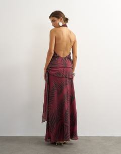 Model wearing Halter neck dropped waist tie detail maxi dress in burgundy zebra print