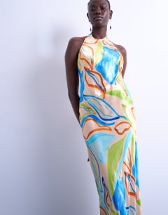 Model wearing Halter neck maxi dress in blue boutique print