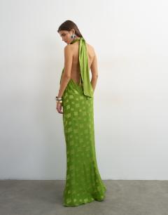 Model wearing Halter neck tucked side maxi dress with burnout square print detail in green