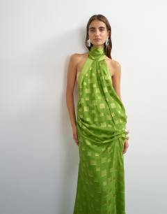 Model wearing Halter neck tucked side maxi dress with burnout square print detail in green