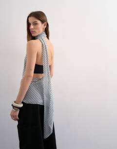 Model wearing Halter scarf detail top in blue stripe