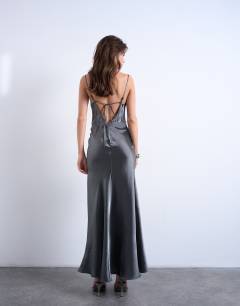 Model wearing Halter tie neck liquid metallic maxi slip dress in silver