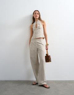 Model wearing Halter top with keyhole detail in woven black stripe